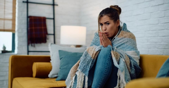 Woman feeling very cold in her apartment