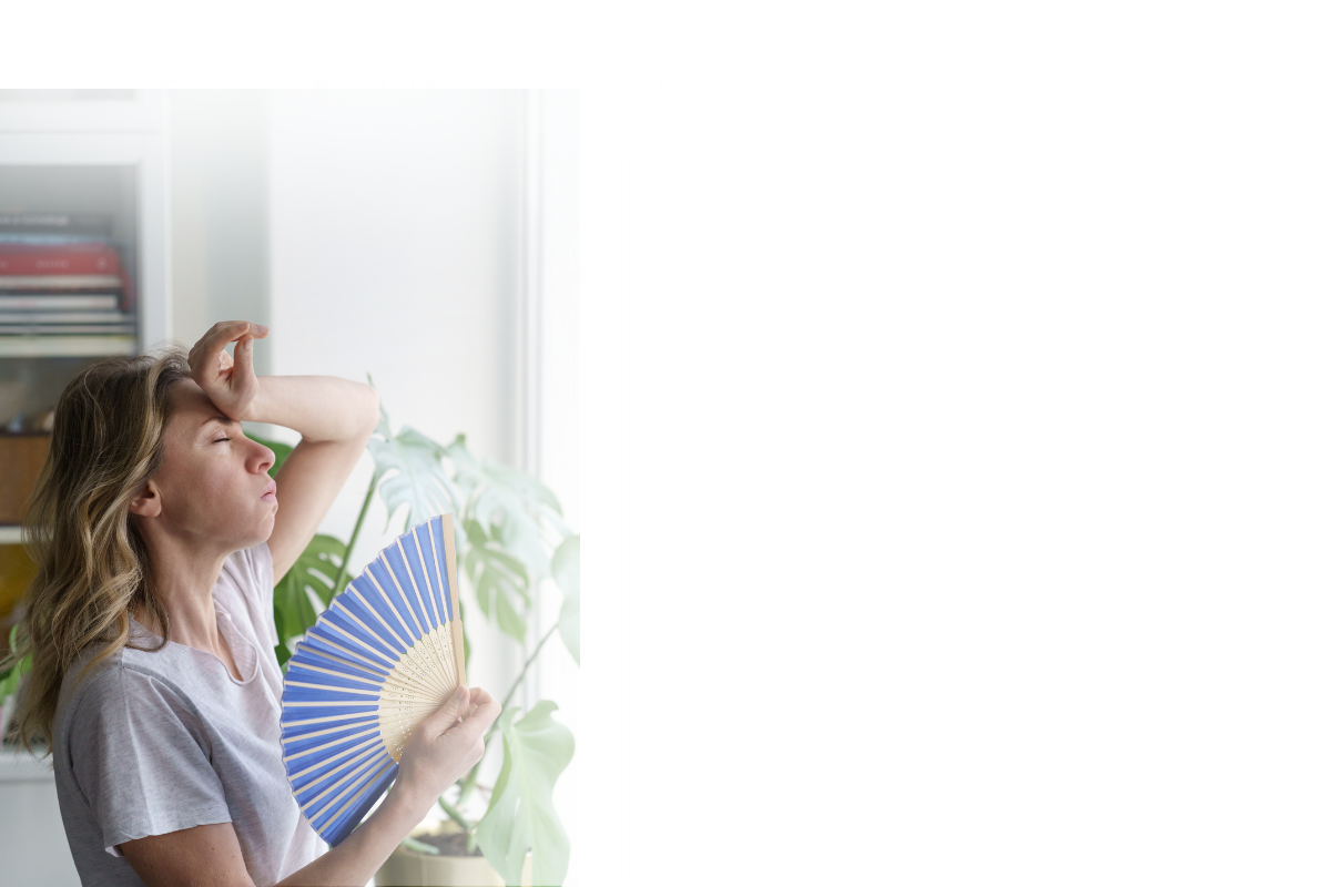 Andgar Home Comfort is ready if you need air conditioning installed at home. Picture of a woman with her hand at her forehead looking hot, holding a blue paper fan